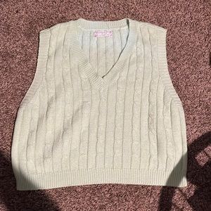 This a cute bright green, very spring vest that you can style however you want.